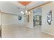 Open dining and kitchen space with tile flooring and stainless steel appliances in the background at 6516 Palm Leaf Ct, Sarasota, FL 34243