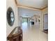 Spacious living room with tile flooring, decorative wall trim, and ample natural light at 6516 Palm Leaf Ct, Sarasota, FL 34243