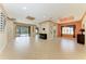 Large living area with tile flooring, custom ceiling details, and sliding glass doors to outdoor space at 6516 Palm Leaf Ct, Sarasota, FL 34243
