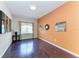 Comfortable office boasts hardwood flooring, a large window, and charming wall decor at 6516 Palm Leaf Ct, Sarasota, FL 34243