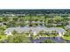 Aerial view of condo complex overlooking golf course, lake, and lush landscaping at 7110 Fairway Bend Ln # 181, Sarasota, FL 34243