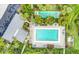 Aerial view featuring a pool and shuffleboard court in the neighborhood at 7110 Fairway Bend Ln # 181, Sarasota, FL 34243