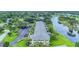 Aerial view of the complex showing beautiful water features and lush, green landscaping at 7110 Fairway Bend Ln # 181, Sarasota, FL 34243