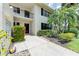 Charming condo exterior with mature landscaping, mailbox, and well-maintained grounds at 7110 Fairway Bend Ln # 181, Sarasota, FL 34243