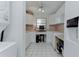 Well-organized kitchen features white cabinets, modern appliances, built in desk, and clean aesthetic at 7110 Fairway Bend Ln # 181, Sarasota, FL 34243