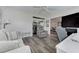 Inviting living area with comfortable seating and neutral decor, leading to a second living area with TV at 7110 Fairway Bend Ln # 181, Sarasota, FL 34243