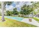 Outdoor shuffleboard court surrounded by lush landscaping and comfortable seating at 7110 Fairway Bend Ln # 181, Sarasota, FL 34243