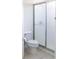 This bathroom has a standing shower, a toilet, and tile flooring at 7137 Cedar Hollow Cir, Bradenton, FL 34203