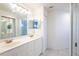 Bright bathroom features double sinks, tile flooring and a walk in shower at 7137 Cedar Hollow Cir, Bradenton, FL 34203