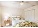 Charming bedroom with a white metal bed frame, floral bedding, and a large closet at 7137 Cedar Hollow Cir, Bradenton, FL 34203