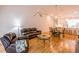 Inviting living room, with an open floorplan, flowing into dining area and featuring wood floors at 7137 Cedar Hollow Cir, Bradenton, FL 34203