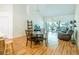 Spacious living room with hardwood floors, high ceilings, and access to screened patio at 7137 Cedar Hollow Cir, Bradenton, FL 34203