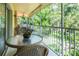 Serene screened patio offering delightful views of the surrounding greenery and nature at 7137 Cedar Hollow Cir, Bradenton, FL 34203