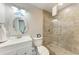 Bathroom featuring a shower, toilet and sink with nautical decor at 733 Holly Rd, Anna Maria, FL 34216
