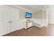 Functional area with built in storage, TV and recessed lighting at 733 Holly Rd, Anna Maria, FL 34216
