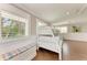 Bright bedroom with a triple bunk bed, natural light, and wainscoting at 733 Holly Rd, Anna Maria, FL 34216