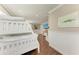 Neutral toned bunk room with wainscoting, recessed lighting and wood-look tile flooring at 733 Holly Rd, Anna Maria, FL 34216