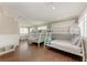 room with three bunk beds and wood-look tile at 733 Holly Rd, Anna Maria, FL 34216