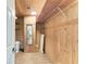 Walk-in cedar closet with wood planking, and built in storage and organization at 733 Holly Rd, Anna Maria, FL 34216