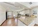 Well-lit kitchen featuring stainless steel appliances, granite countertops, and ample storage at 733 Holly Rd, Anna Maria, FL 34216