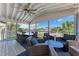 Covered outdoor space with seating and dining areas, ideal for entertaining and relaxing outdoors at 733 Holly Rd, Anna Maria, FL 34216