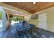 Recreation room with ping pong table, TV and bar with seating. Great for gatherings and fun at 733 Holly Rd, Anna Maria, FL 34216