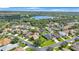 Scenic aerial view of a neighborhood with lush landscaping and a tranquil lake at 7615 Charleston St, Bradenton, FL 34201