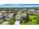 An aerial view showcasing a well-maintained home with a manicured lawn and a long driveway at 7615 Charleston St, Bradenton, FL 34201