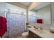 Bathroom featuring a vanity, mirror, and shower/tub combo at 7615 Charleston St, Bradenton, FL 34201