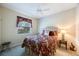 Bedroom with a ceiling fan, window, and floral bedspread at 7615 Charleston St, Bradenton, FL 34201