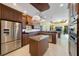 Spacious kitchen with modern stainless steel appliances, custom cabinetry, and a center island at 7615 Charleston St, Bradenton, FL 34201