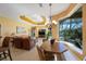 Sun-filled living room featuring tray ceilings, large windows, and comfortable seating at 7615 Charleston St, Bradenton, FL 34201