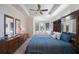 Comfortable main bedroom with a tray ceiling and furniture at 7615 Charleston St, Bradenton, FL 34201