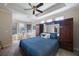 Comfortable main bedroom with a tray ceiling, a sitting area, and furniture at 7615 Charleston St, Bradenton, FL 34201