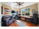 Comfortable home office with hardwood floors, fan, and window views at 7615 Charleston St, Bradenton, FL 34201