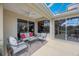 Covered patio area with comfortable seating and access to the pool and backyard at 7615 Charleston St, Bradenton, FL 34201