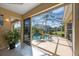 Inviting pool area with a screened enclosure, lush landscaping, and ample seating at 7615 Charleston St, Bradenton, FL 34201