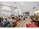 Bright and airy living room with high ceilings, large windows, and an open concept design at 7716 Geneva Ln, Sarasota, FL 34243
