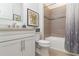 Updated bathroom features a bathtub with tile surround, vanity and modern fixtures at 7758 Summerland Cv, Bradenton, FL 34202