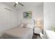 Bright bedroom features a ceiling fan, closet, and bedside tables providing a comfortable retreat at 7758 Summerland Cv, Bradenton, FL 34202