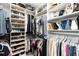 Organized walk-in closet with custom shelving and hanging rods for optimal storage solutions at 7758 Summerland Cv, Bradenton, FL 34202