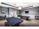 Brightly lit game room is the perfect place to unwind and enjoy playing a game of pool with friends and Gathering at 7758 Summerland Cv, Bradenton, FL 34202