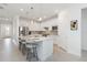 Well-lit kitchen with an island and seating, offering a functional and aesthetically pleasing space at 7758 Summerland Cv, Bradenton, FL 34202
