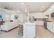 Open concept kitchen with an island, stainless steel appliances, and seamless integration with the living area at 7758 Summerland Cv, Bradenton, FL 34202