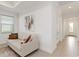 Neutral-toned living room with large window and French doors at 7758 Summerland Cv, Bradenton, FL 34202