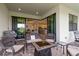 Inviting patio featuring comfortable seating, a fire pit, and seamless access to indoor living spaces at 7758 Summerland Cv, Bradenton, FL 34202