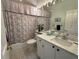 Cozy bathroom with a shower-tub combo, a toilet and a vanity with an oversized mirror at 8616 15Th Nw Ave, Bradenton, FL 34209