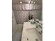 Cozy bathroom featuring a shower-tub combo, toilet and a vanity with an oversized mirror at 8616 15Th Nw Ave, Bradenton, FL 34209