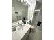 Modern bathroom with a glass-enclosed shower, vanity and mirror with overhead lighting at 8616 15Th Nw Ave, Bradenton, FL 34209