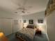 Comfortable bedroom with a ceiling fan, two side tables, and a queen-size bed at 8616 15Th Nw Ave, Bradenton, FL 34209
